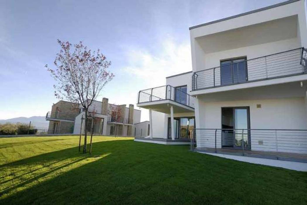 COMPLESSO RESIDENZIALE “MIRANTE”, POMP0NI ASSOCIATI SRL POMP0NI ASSOCIATI SRL Modern houses