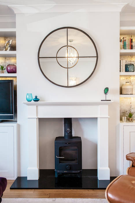 Colourful Eclectic London Sitting Room Lauren Gilberthorpe Interiors Living room Log burner,fireplace,circle mirror,bookshelves