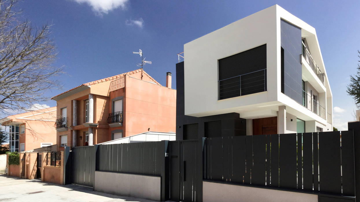 Fachada frontal arqubo arquitectos Casas estilo moderno: ideas, arquitectura e imágenes Cerámico