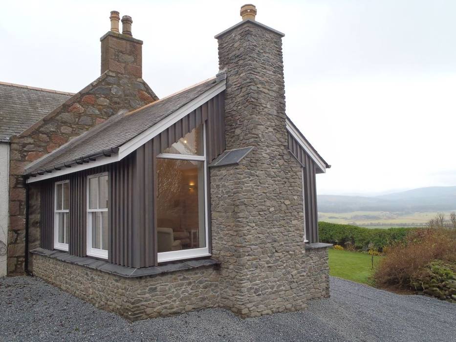 Side view of Sunroom Corylus Architects Ltd. Classic style conservatory Granite Sunroom,Extension