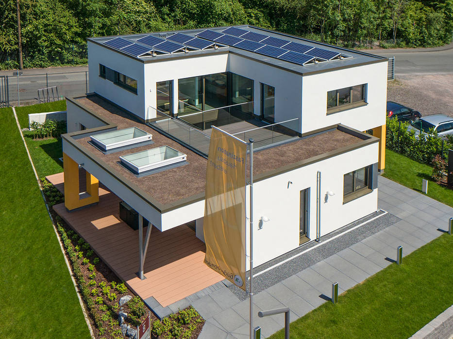 Zukunft ist Zuhause: Plus-Energie-Haus mit faszinierenden Raffinessen, Büdenbender Hausbau GmbH Büdenbender Hausbau GmbH Casas modernas Madera Acabado en madera