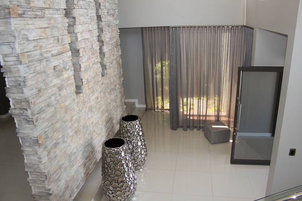 Entrance Hall Inside Out Interiors Modern Corridor, Hallway and Staircase entrance hall,sandstone cladding,porcelain tiles,voile,feature pots,focal wall.