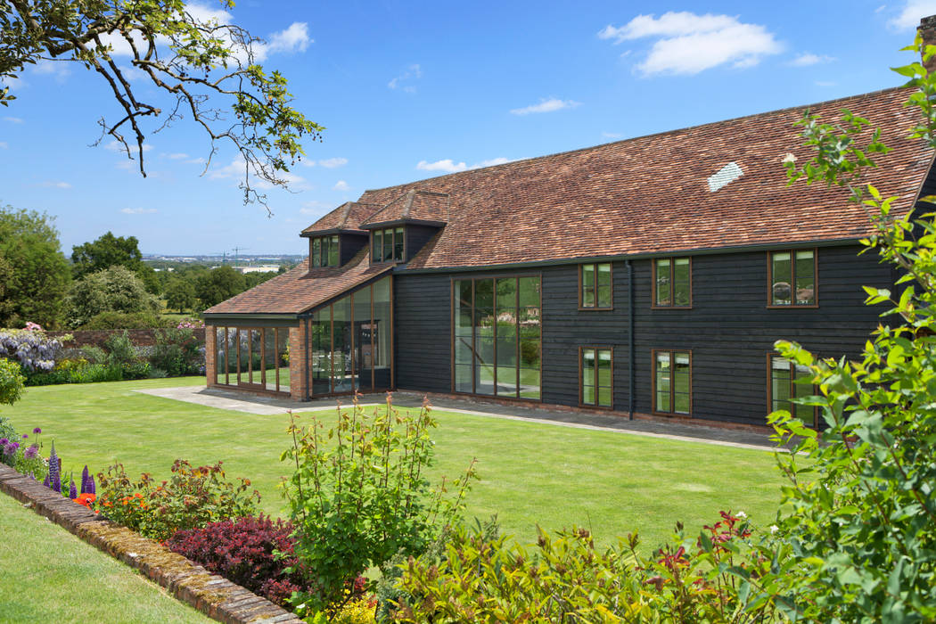 Barn Conversion with Oak Conservatory Vale Garden Houses بيت زجاجي خشب Wood effect conservatory,orangery,garden room,outdoor,bespoke,timber,aluminium,glass,roof light,roof light