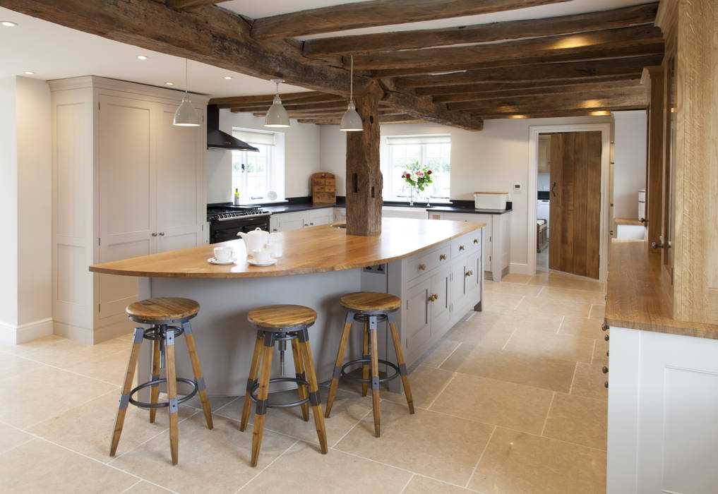 Old English - Bespoke kitchen project in Cambridgeshire Baker & Baker Rustic style kitchen Island,seating,kitchen stools,oak worktop,beams,kitchen cupboards,tile floor,oak internal doors