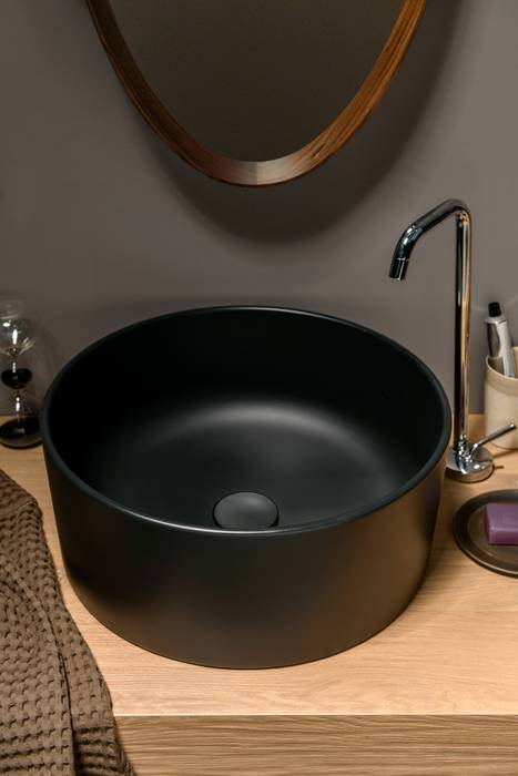 homify Modern bathroom مصنوعی Brown Sinks