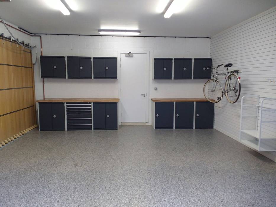 Resin Floor, Metal Cabinets and Bike Storage Galore in this lovely garage makeover in Cambridge Garageflex Moderne garage garage,built-in storage,fitted,storage,garage door,metal,cabinet,cupboard,wall paneling,floor,resin,bike