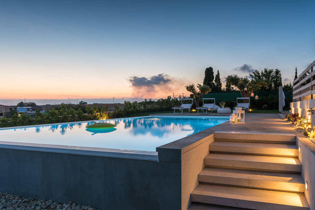 Villa: Una forte relazione tra gli ambienti interni e il paesaggio, DFG Architetti Associati DFG Architetti Associati Moderne Pools