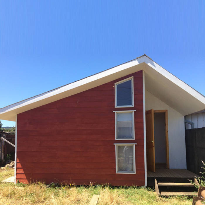 Fachada ESARCA Casas de estilo clásico Madera Acabado en madera