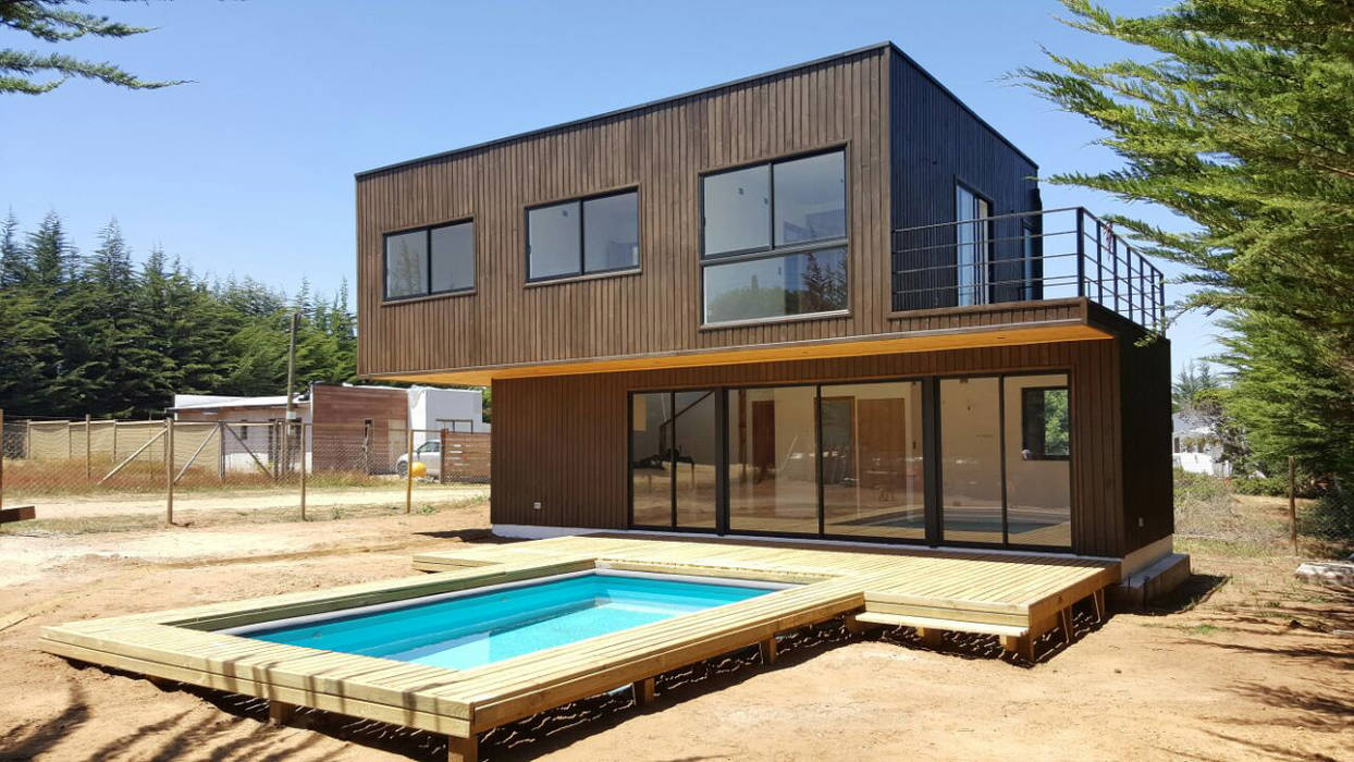 Fachada ESARCA Casas de estilo mediterráneo Madera Acabado en madera