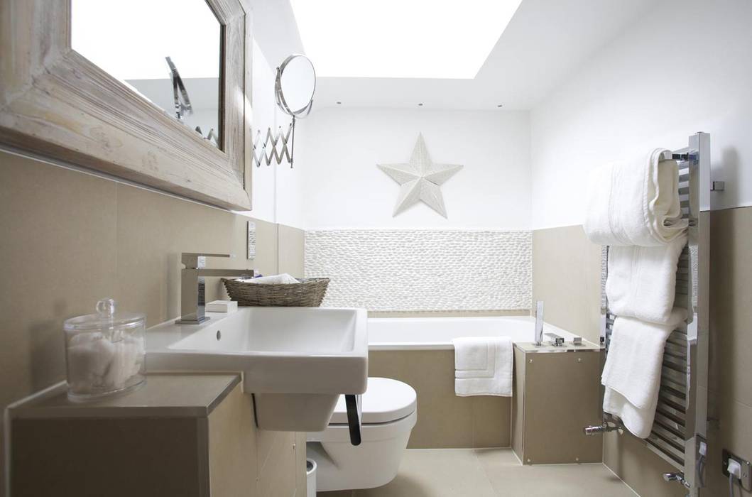 homify Casas de banho ecléticas Bathroom,recessed sink,wall hung toilet,bath,tiles,holiday home,luxury.