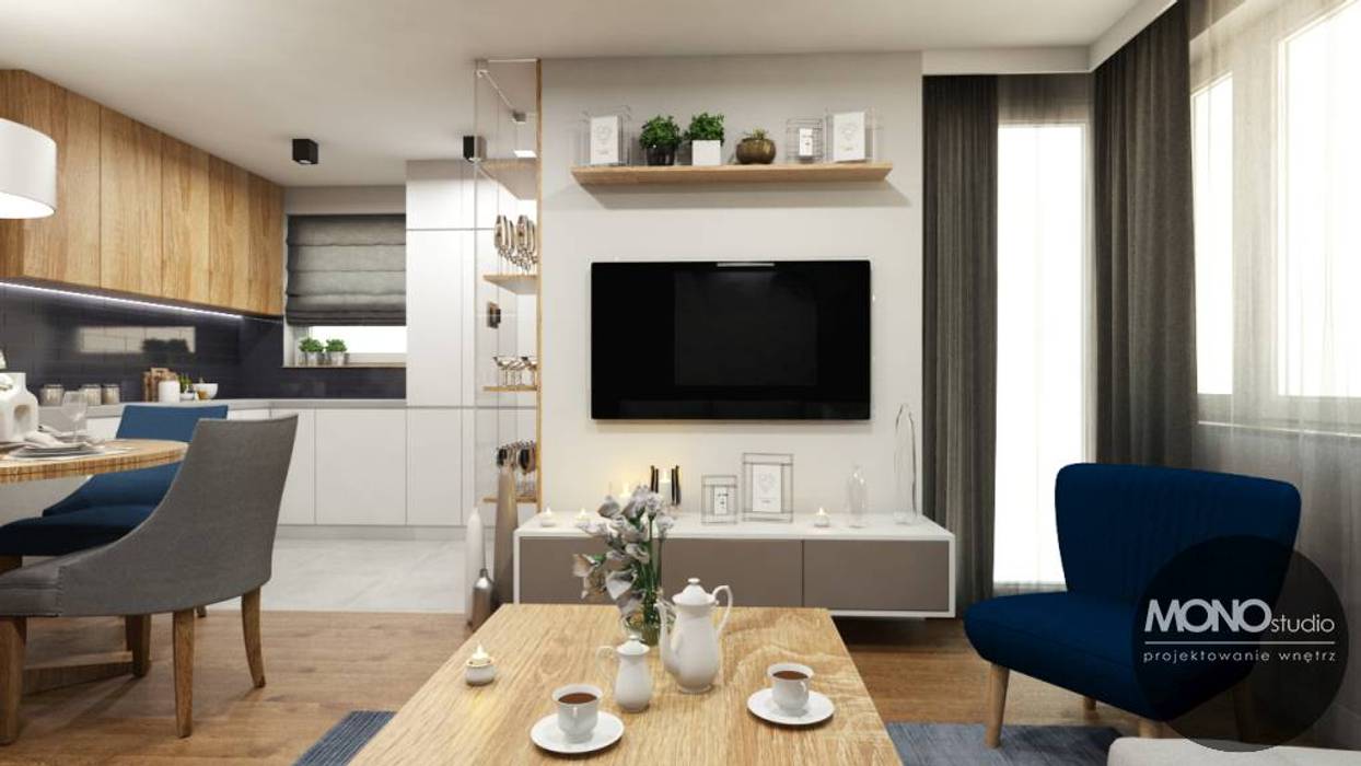 Mieszkanie stanowiące połączenie różnych stylów z charakterystycznymi niebieskimi dodatkami, MONOstudio MONOstudio Soggiorno eclettico