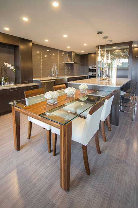 Dining Area Kevin Gray Interiors モダンデザインの ダイニング glass dining table,leather chairs,wood floor,grey cabinets,LED pot lights
