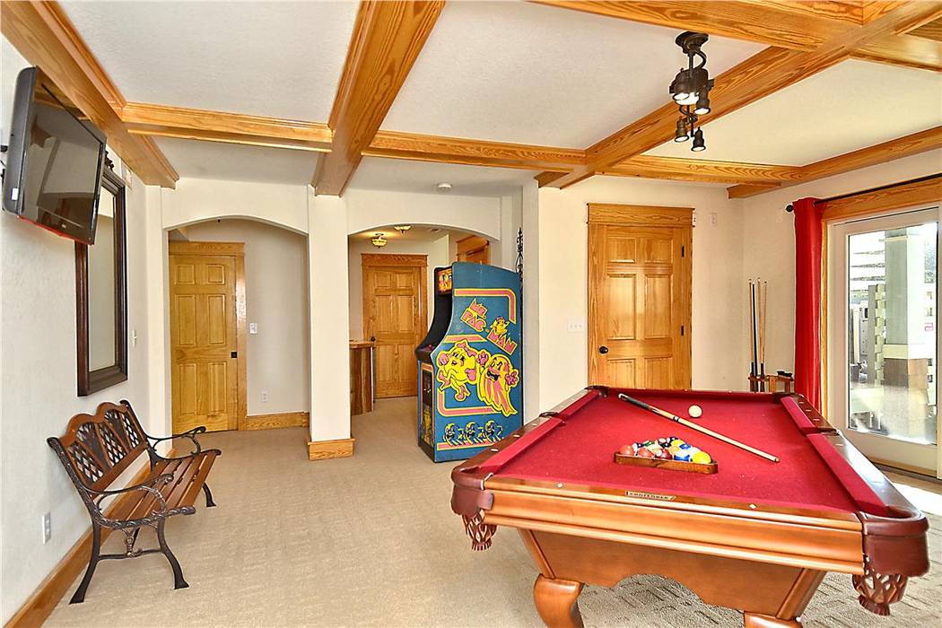 game room with pool table and arcade Outer Banks Renovation & Construction Modern media room