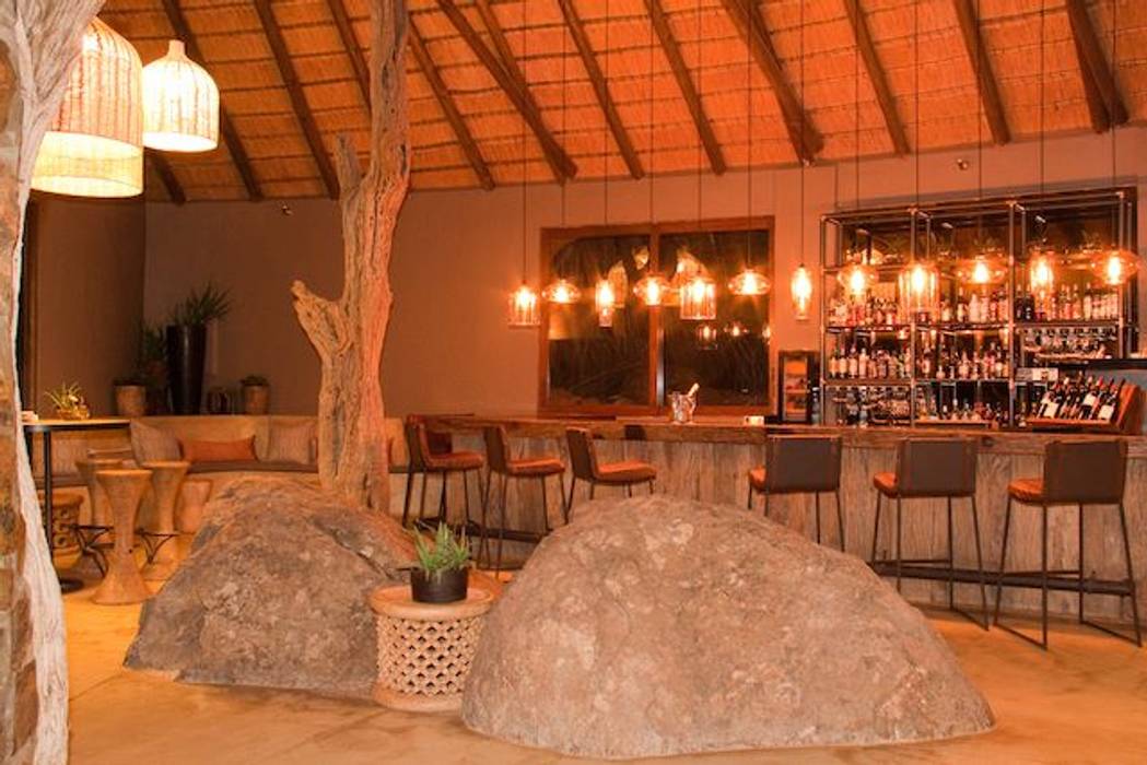 Madikwe Hills Bar Nowadays Interiors Commercial spaces Copper/Bronze/Brass pendant light,glass pendant,lodge interior,leather bar stool,Bars & clubs