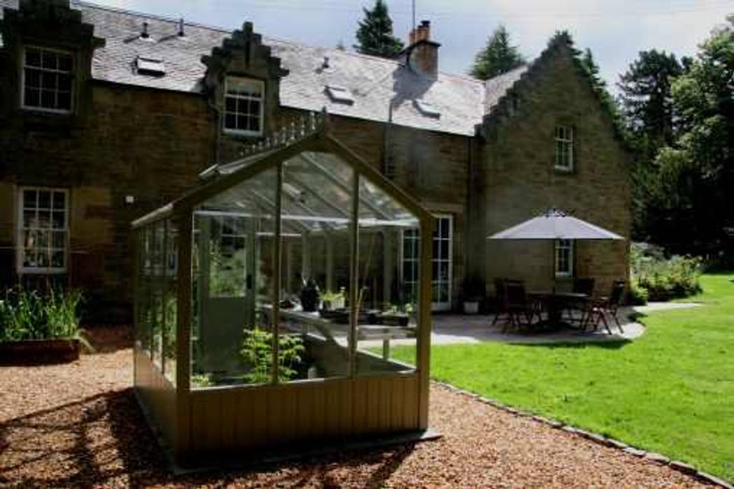 Wooden greenhouse in a gravel path, with a brick edge to lawn. Colinton Gardening Services - garden landscaping for Edinburgh Antejardines garden patios Edinburgh