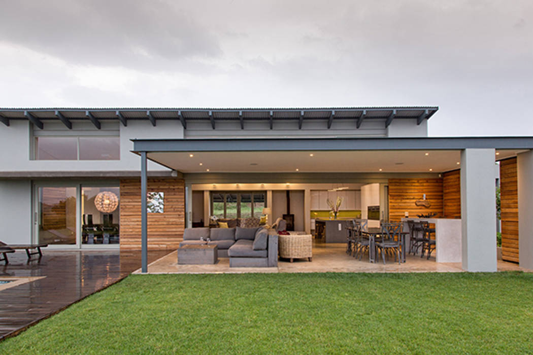 Lodge Gregory, homify Modern houses covered patio,timber cladding,cavity doors,steel,concrete,bar