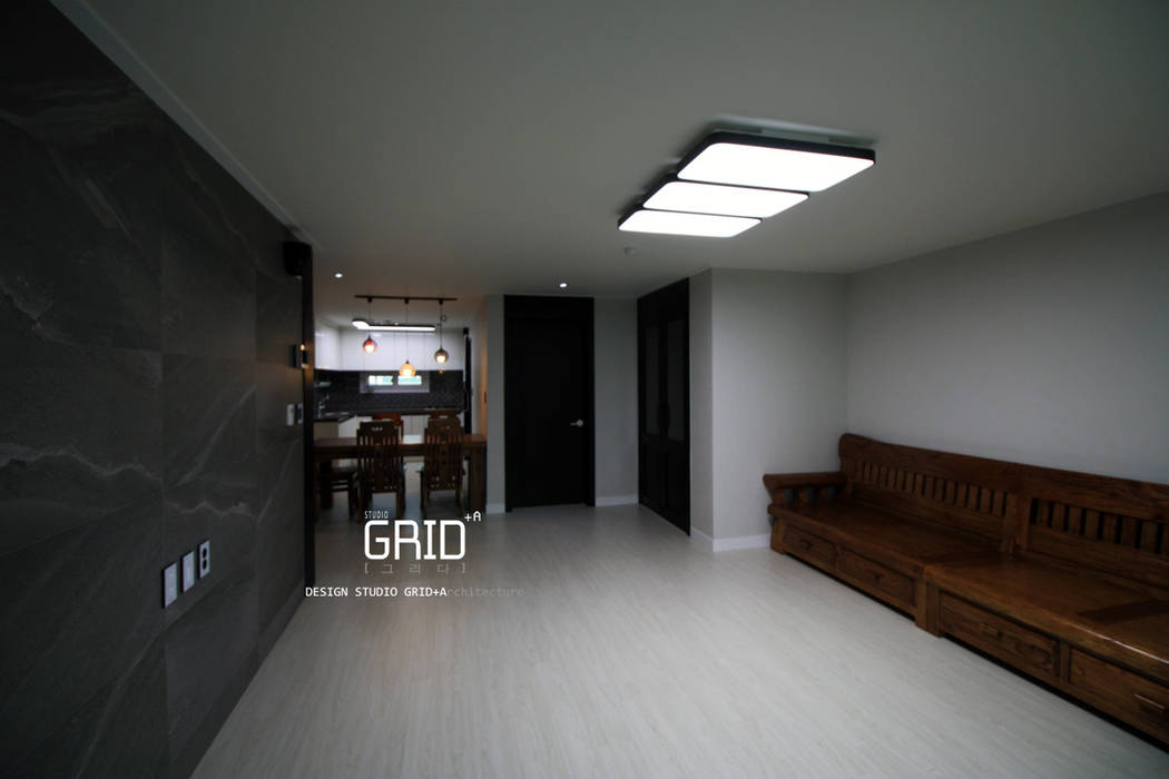 거실인테리어 Design Studio Grid+A 모던스타일 거실 거실인테리어,아트월,모노톤,좌석,환기 장치,환기 장치