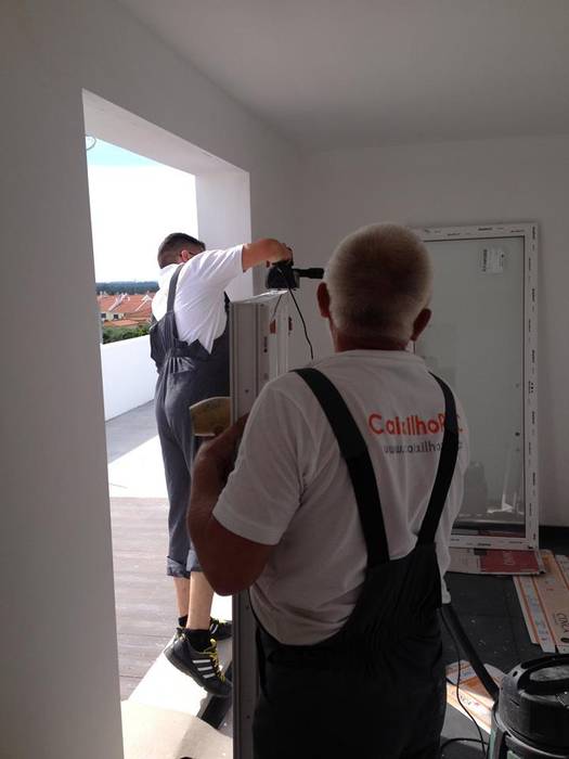 Casas clásicas de homify Clásico Vidrio