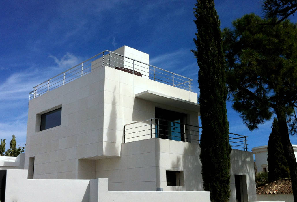 Vivienda particular revestida en piedra natural blanca Rosal Stones Espacios comerciales Piedra Edificios de Oficinas