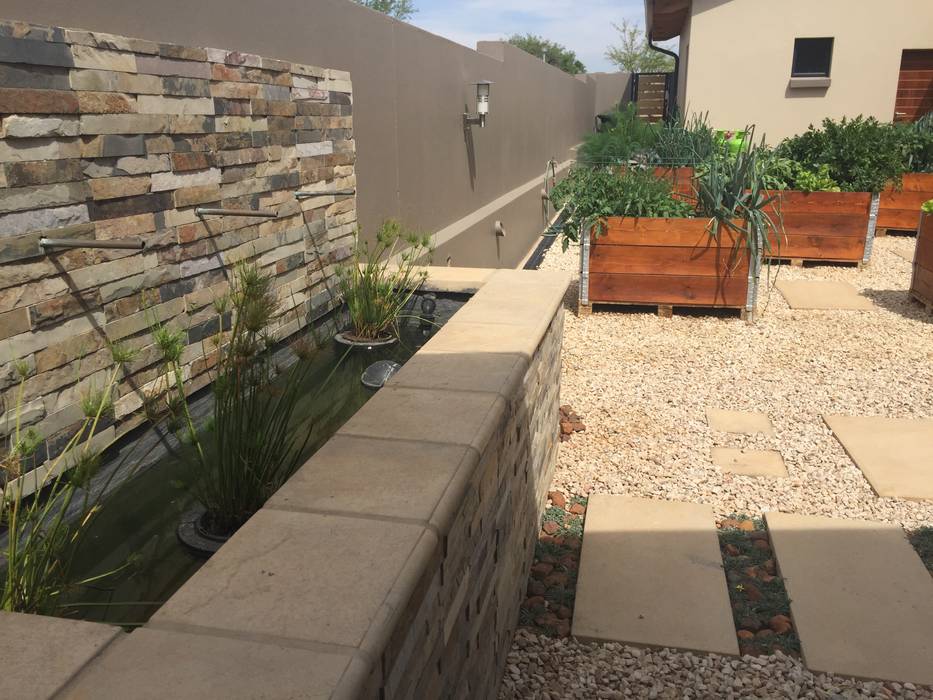 Water feature focal point in kitchen garden Acton Gardens Country style garden water feature,kitchen garden