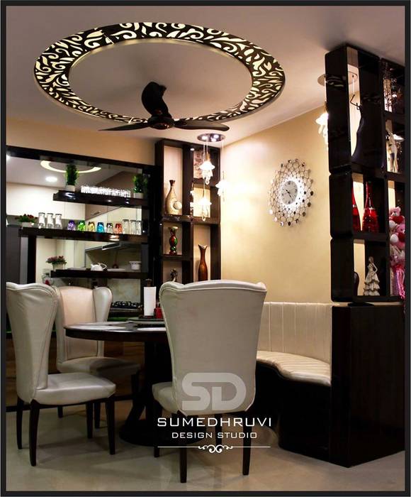 Dining Area Specifying Round Table with Chairs and Ledge Seating SUMEDHRUVI DESIGN STUDIO Modern Dining Room