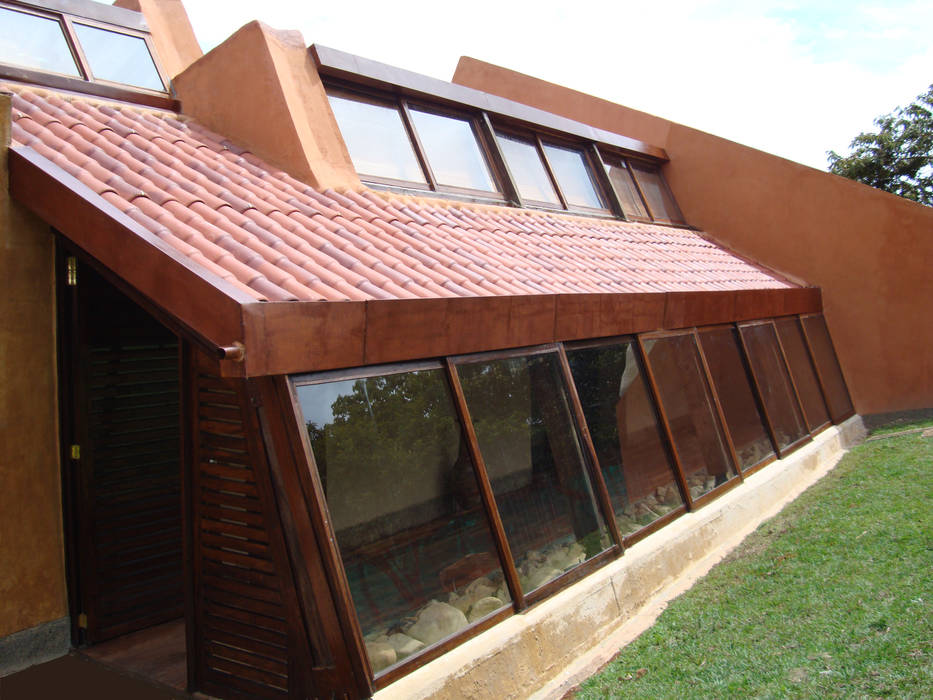 Fachada norte CUNA ARQUITECTURA INGENIERÍA SOSTENIBLE Casas campestres Hierro/Acero Acero oxidado,madera