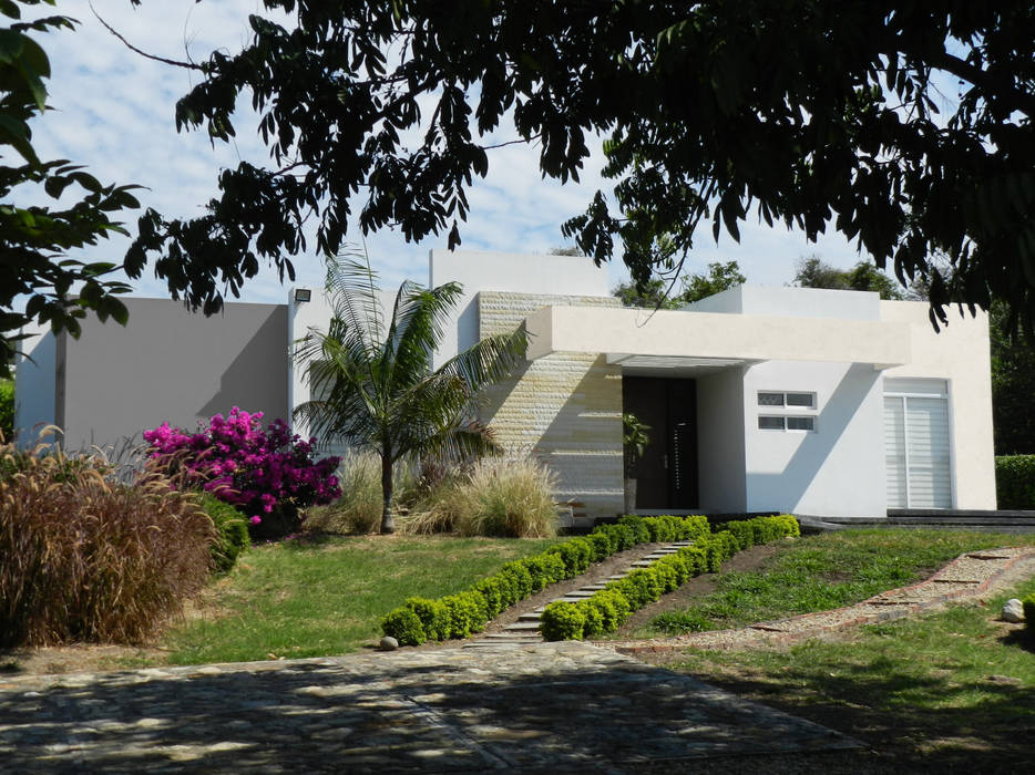 Otras casas de clima calido., Arquitectos y Entorno S.A.S Arquitectos y Entorno S.A.S Modern home