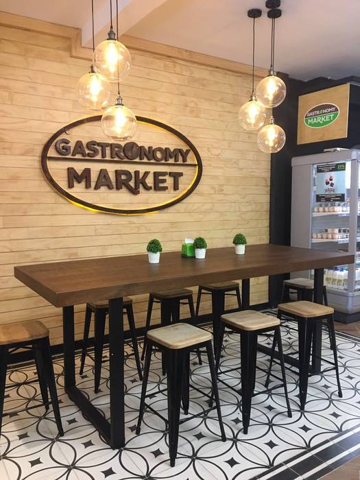 ​Mesa comunal del cafe marisagomezd Espacios comerciales Madera Acabado en madera Locales gastronómicos