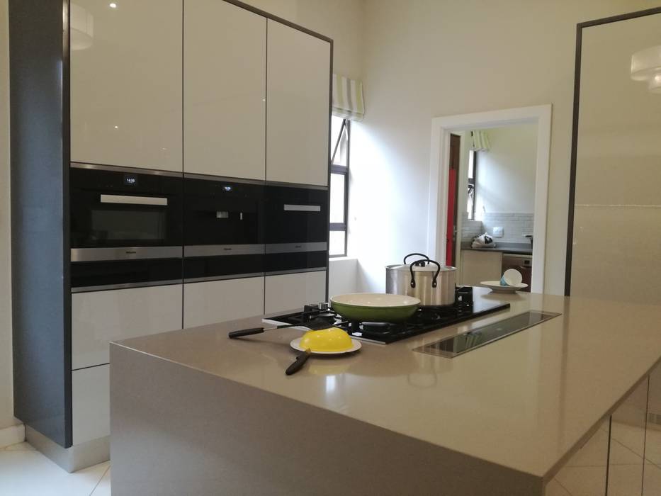 High Gloss Grey Doors With Grey Counter Tops And Charcoal