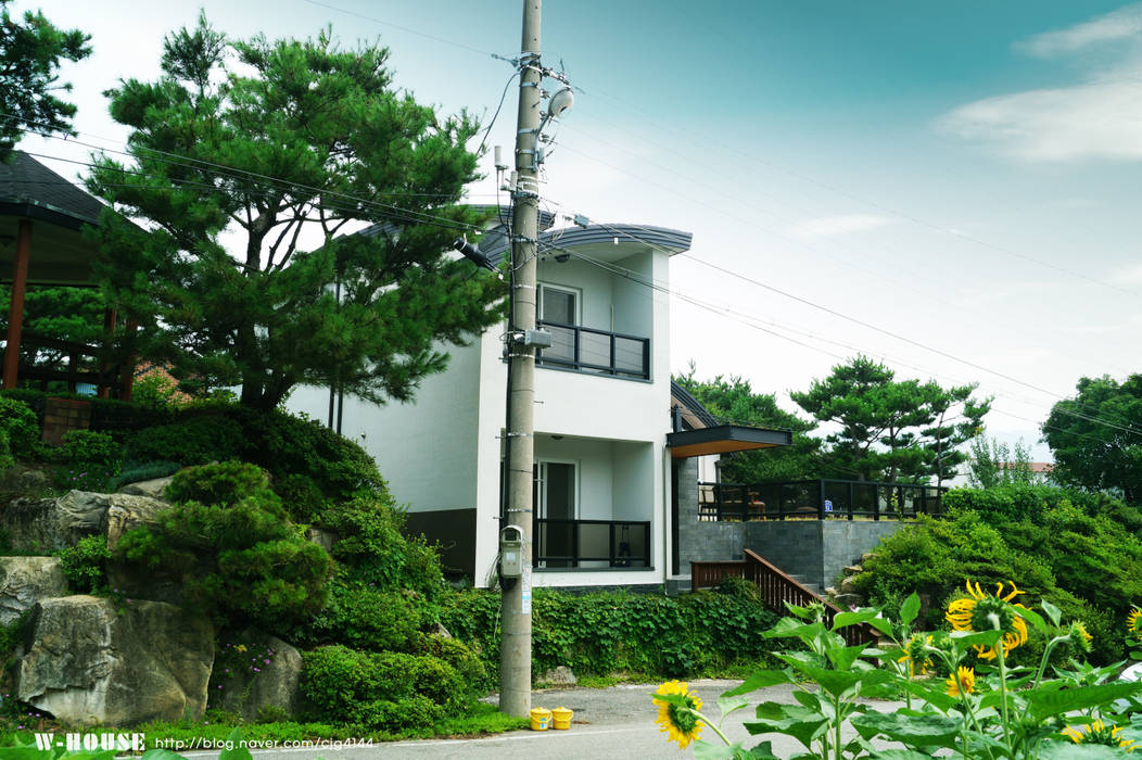 세종시 청벽마을 45평형 ALC친환경 리모델링, W-HOUSE W-HOUSE Casas de campo Concreto