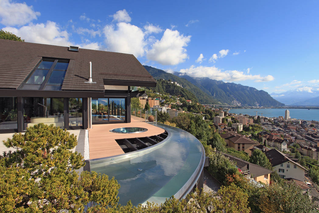 Haus am Hang in Genf am See - CH DAVINCI HAUS GmbH & Co. KG Moderne Pools