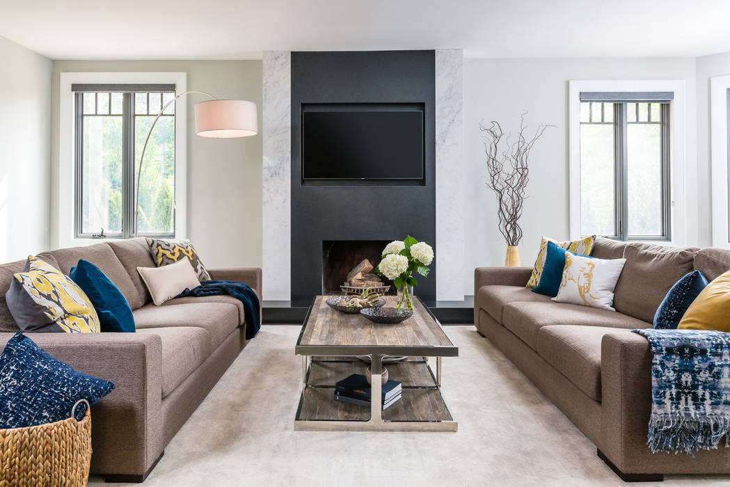 Modern comforts Frahm Interiors Modern living room large sofas,fireplace,television,marble,granite,blue,black,rug