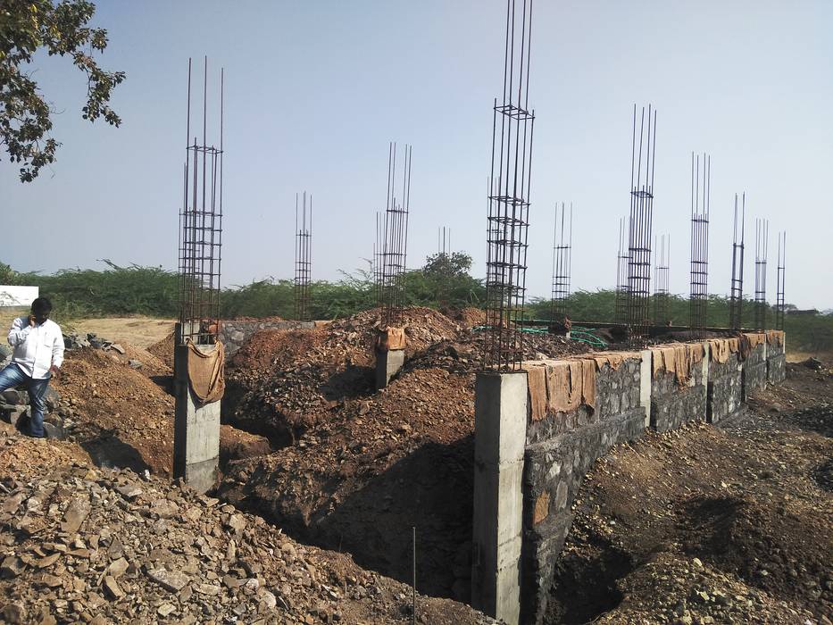 Casting of Column & UCRM (Uncoursed Rubble masonry) Cfolios Design And Construction Solutions Pvt Ltd Multi-Family house UCRM,masonry,cement mortar,basalt stone