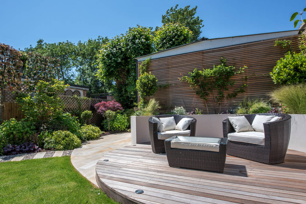 Cosy Decking Perfect for Catching the Evening Sun Kate Eyre Garden Design Modern Garden Kate Eyre Garden Design, Kate Eyre, Balau, Decking, Outdoor Seating, Cedar Cladding, Lawn, Grass, Garden Design, Contemporary, Modern, Raised Bed, Porcelain, Patio, South Facing, Planting, Decking Design, Stepping Stones, Pathway, Garden Storage, Jasmin, Plants, Private, Garden Furniture, Heuchera, Clematis, Phormium