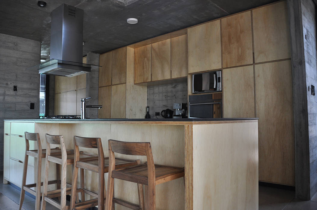 Casa zona sur, En bruto En bruto Cocinas de estilo industrial