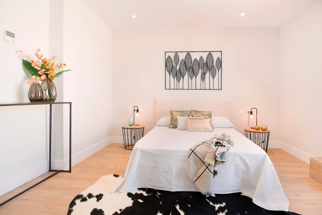Master bedroom Markham Stagers Modern style bedroom home staging,minimal,black and white,rug,cow rug,iron,artwork,throw,leather