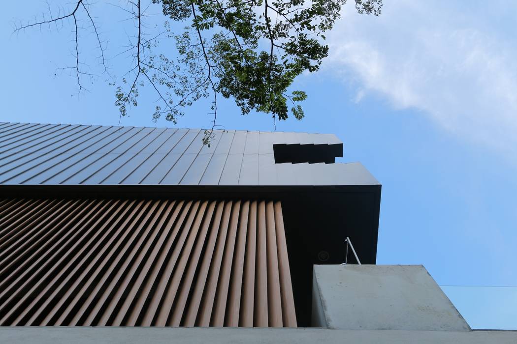 Detail of metal cladding and timber louvre MJ Kanny Architect Modern houses