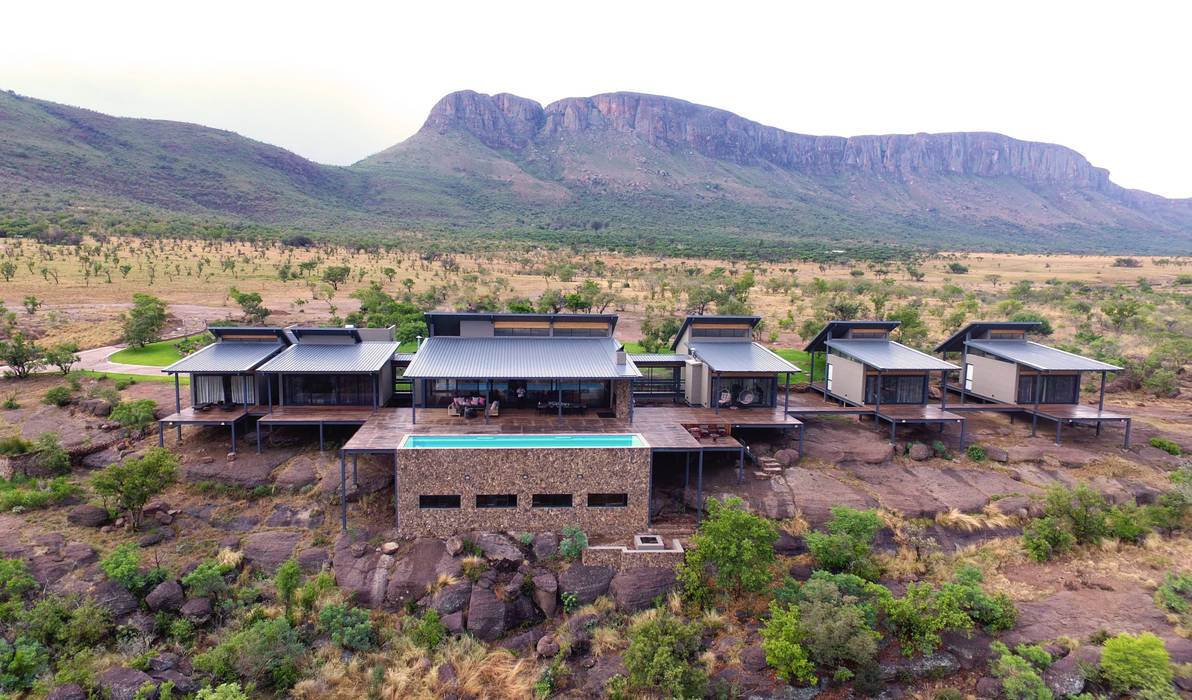 Sitting on the rocky outcrop Hugo Hamity Architects Single family home Iron/Steel