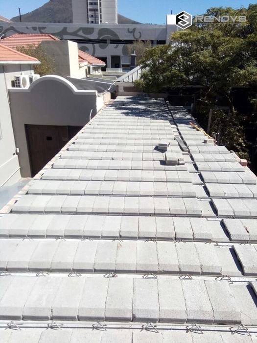 Roof - interlinking buildings: modern by Renov8 CONSTRUCTION, Modern roofing,concrete,safety,structural stability,construction,commercial spaces,renovation,restoration,refurbishment