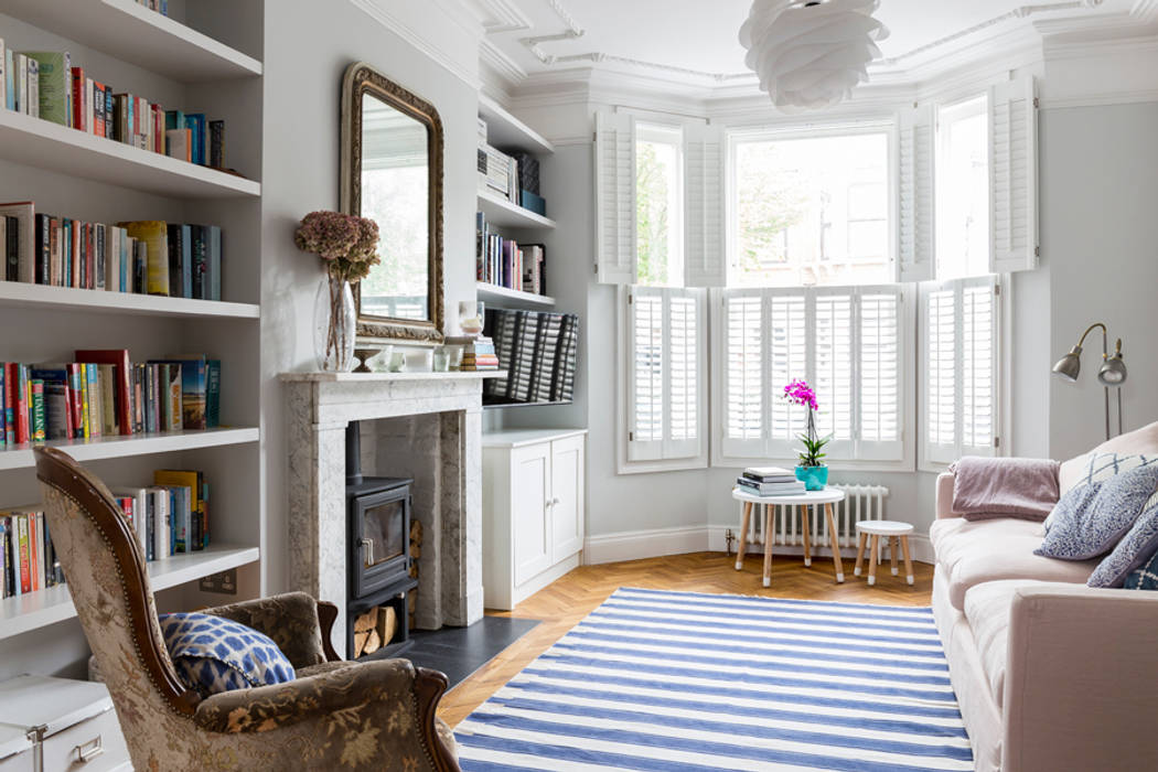 North West London Terraced House, VORBILD Architecture Ltd. VORBILD Architecture Ltd. Classic style living room fireplace,shutters,arm chair,marble surround,stove,book shelves