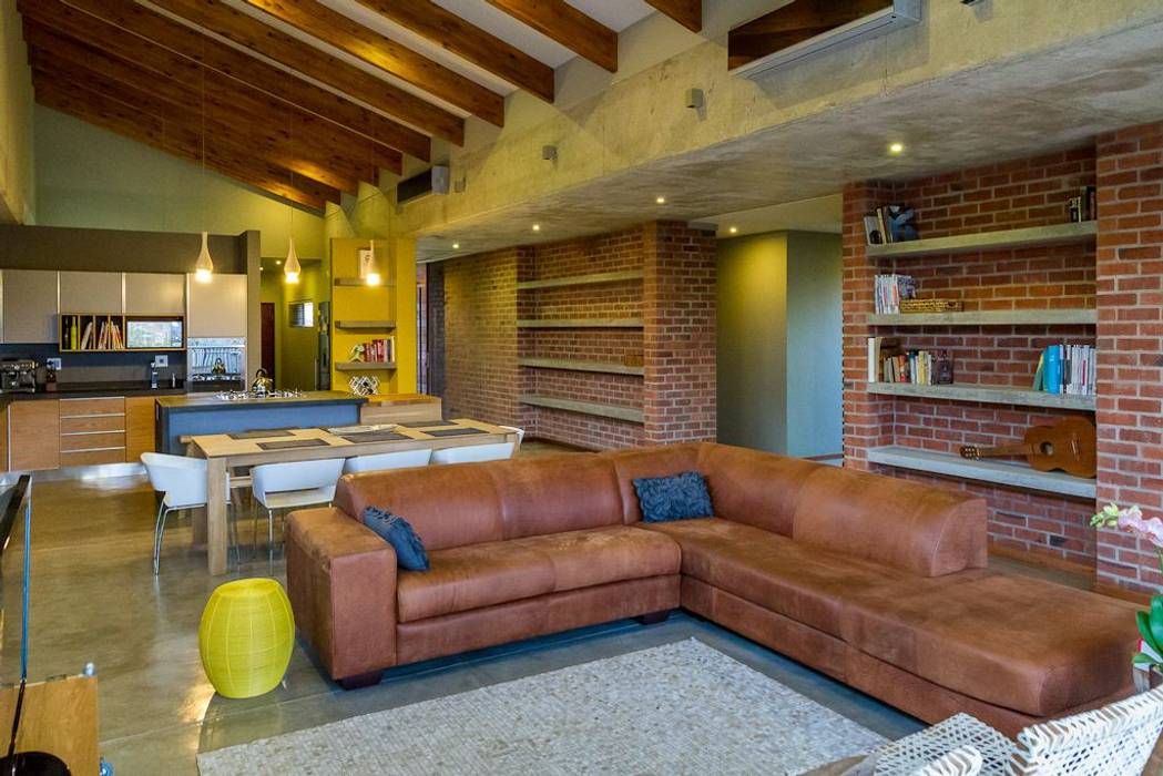 LIVING ROOM ENDesigns Architectural Studio Modern living room Bricks OPEN PLAN,LIVING AREA,EXPOSED TRUSSES,OFF-SHUTTER CONCRETE,HIGH CEILING,concrete flooring