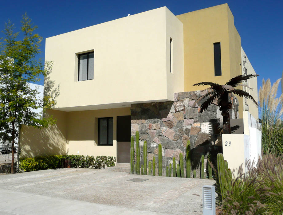 Fachada de estilo rústico contemporáneo Alberto M. Saavedra Detached home پتھر