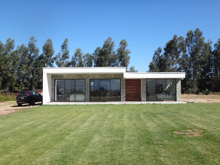 Vivienda Garrido por ARKITEKTURA, ARKITEKTURA ARKITEKTURA Casas unifamiliares Concreto