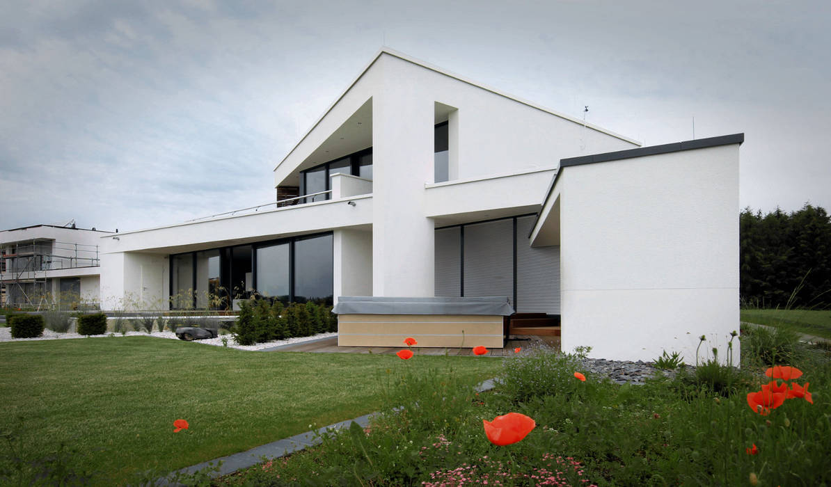 Modernes Designhaus mit Flachdach, Avantecture GmbH Avantecture GmbH Casas modernas