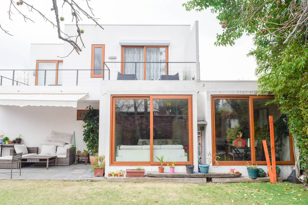 Remodelación de Casa Islas Fidji por Arqbau, Arqbau Ltda. Arqbau Ltda. Casas unifamiliares