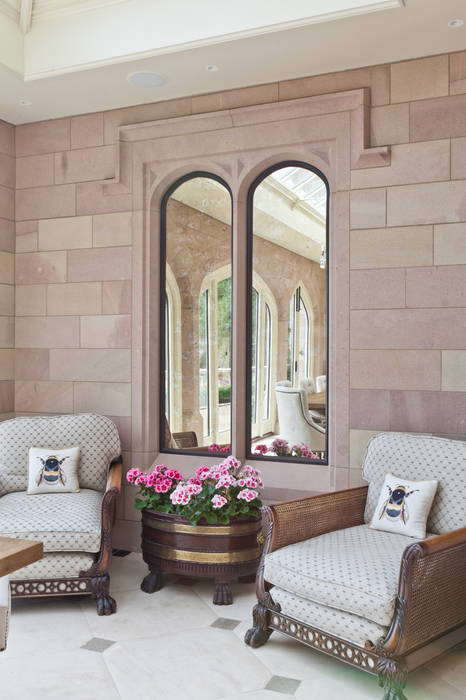 A striking solid construction orangery featuring doors with bronze inserts. Vale Garden Houses Modern Conservatory