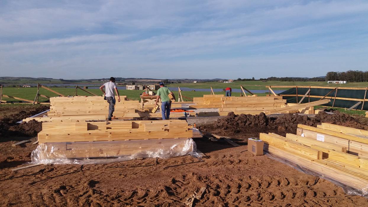 Casa en Uruguay (Construcción en 15 días) Superficie cubierta de 130 m2, Patagonia Log Homes - Arquitectos - Neuquén Patagonia Log Homes - Arquitectos - Neuquén Casas clásicas Derivados de madera Transparente