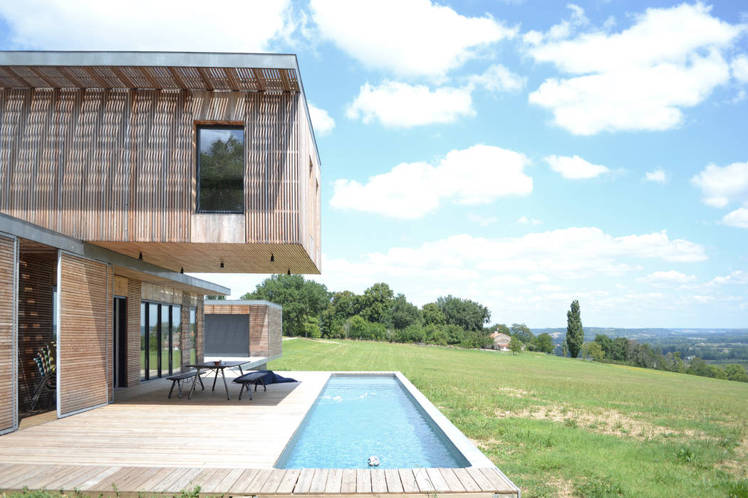 Maison en bois et béton esprit Loft, Créateurs d'Interieur Créateurs d'Interieur Piscines privées Bois Effet bois