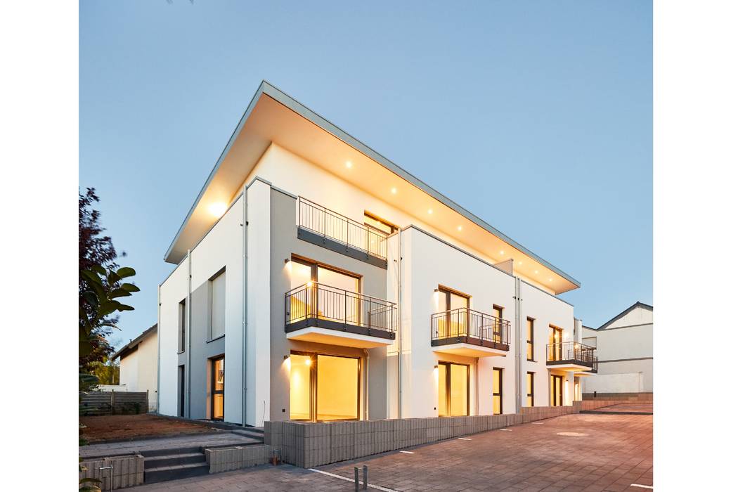 Neubau eines 10-Familienhauses in der Eifel mit Staffelgeschoss, STRICK Architekten + Ingenieure STRICK Architekten + Ingenieure Casas multifamiliares