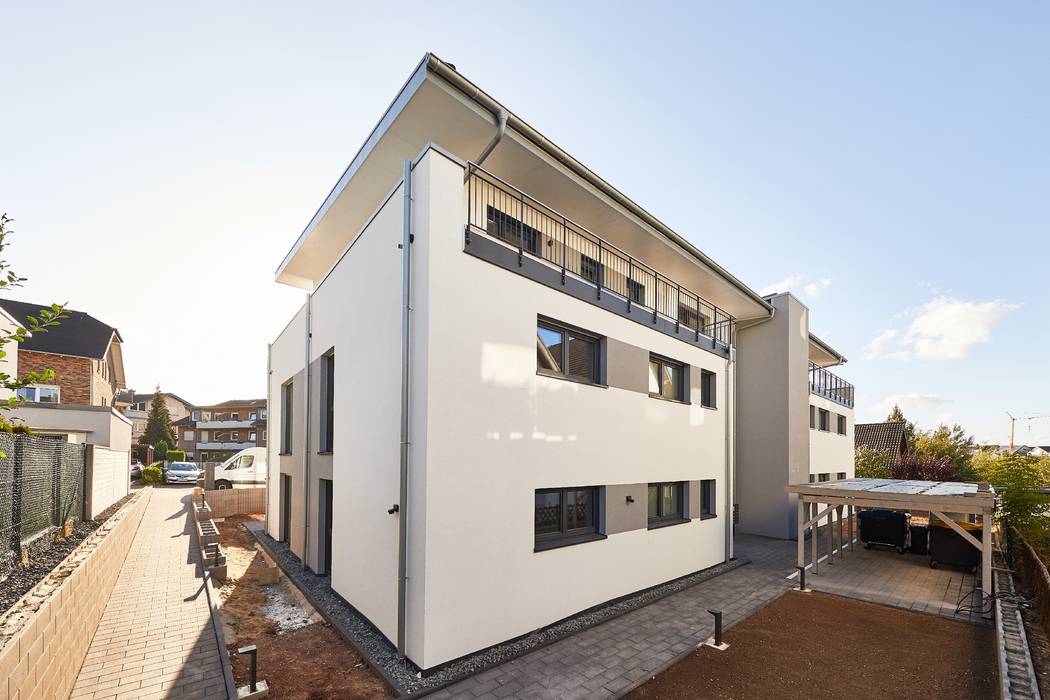 Neubau eines 10-Familienhauses in der Eifel mit Staffelgeschoss, STRICK Architekten + Ingenieure STRICK Architekten + Ingenieure Multi-Family house